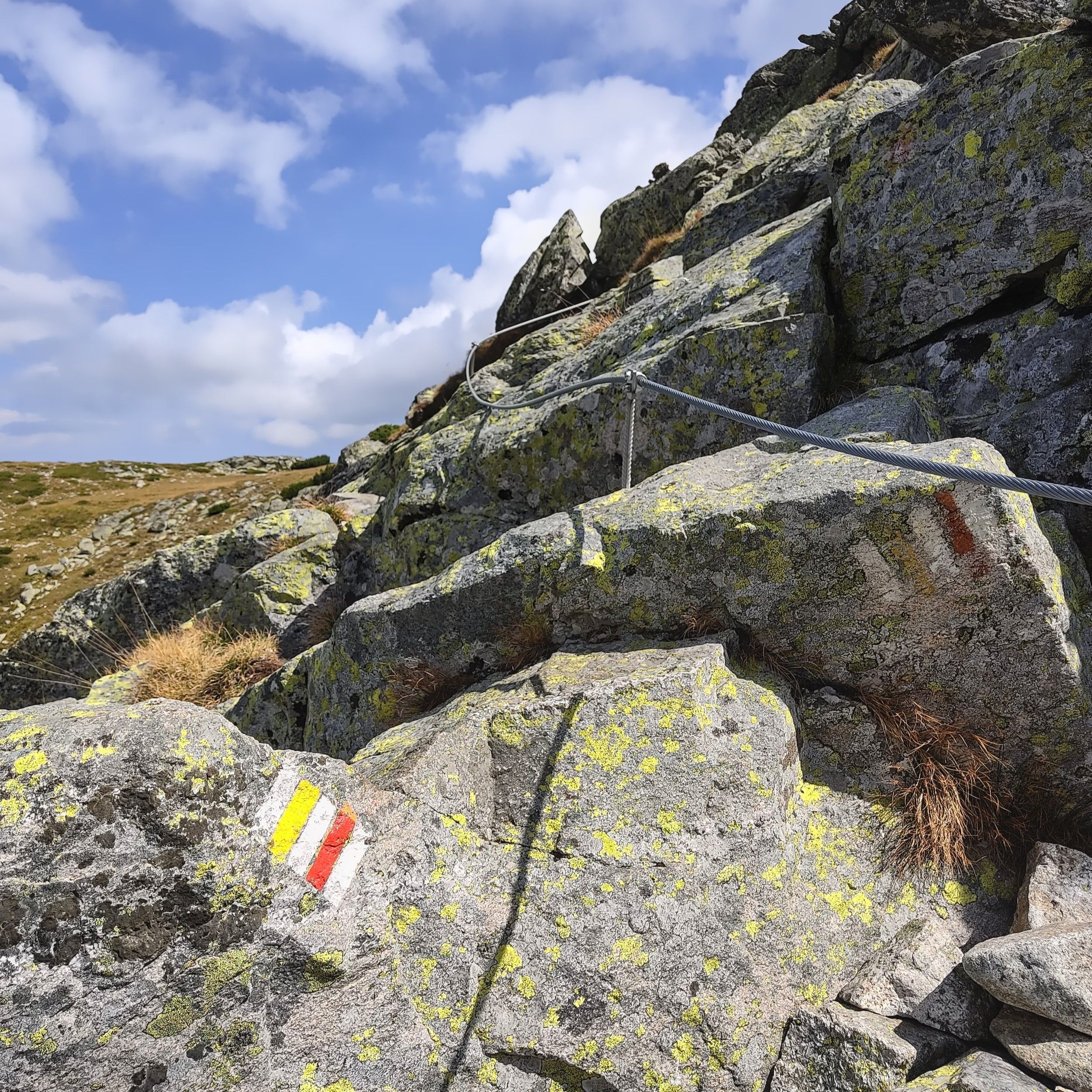 Rocky path with a support cable | Hiking in Rila Mountains, Bulgaria | FinnsAway blog