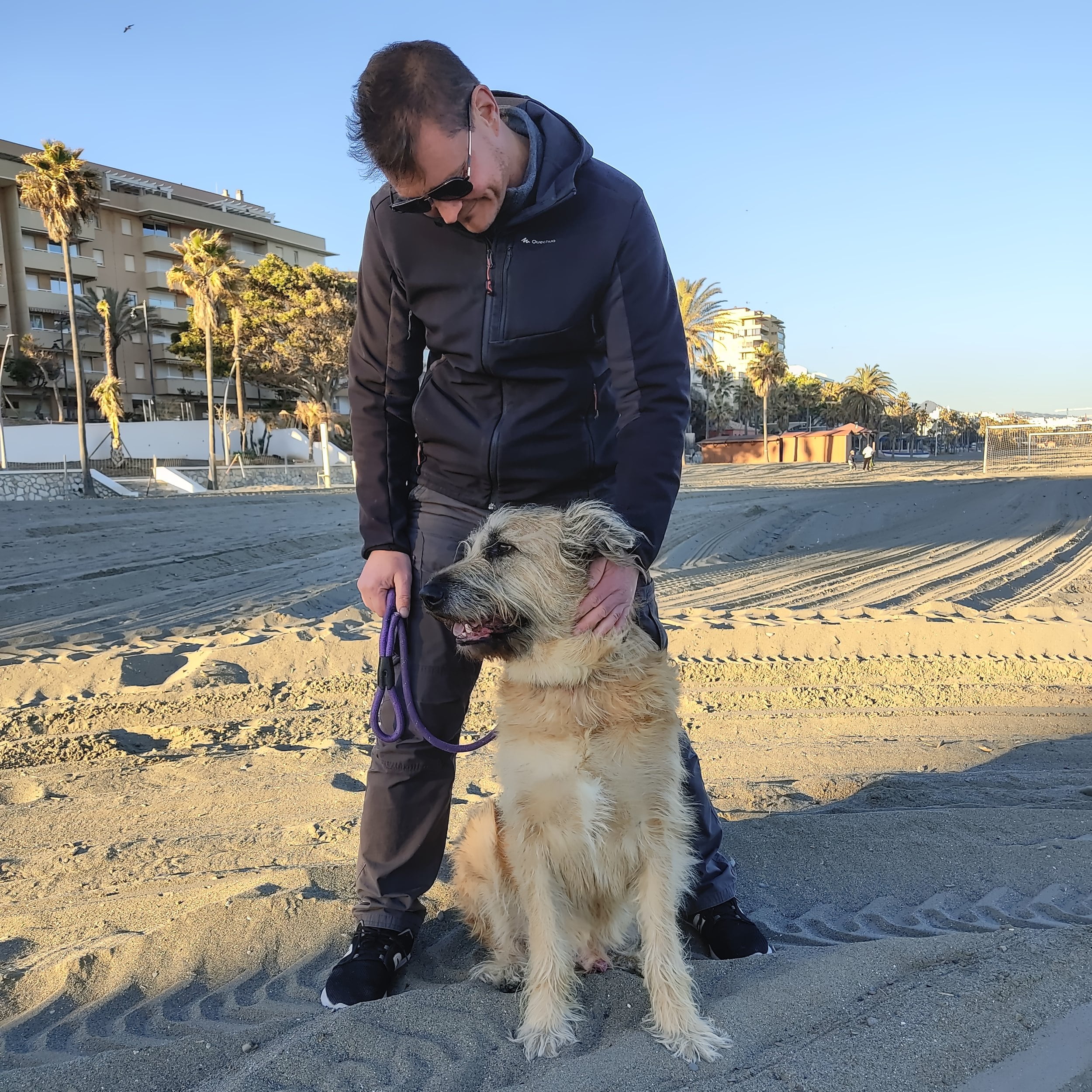 With a dog on a beach | Nomad year 2023 summary | FinnsAway Travel Blog