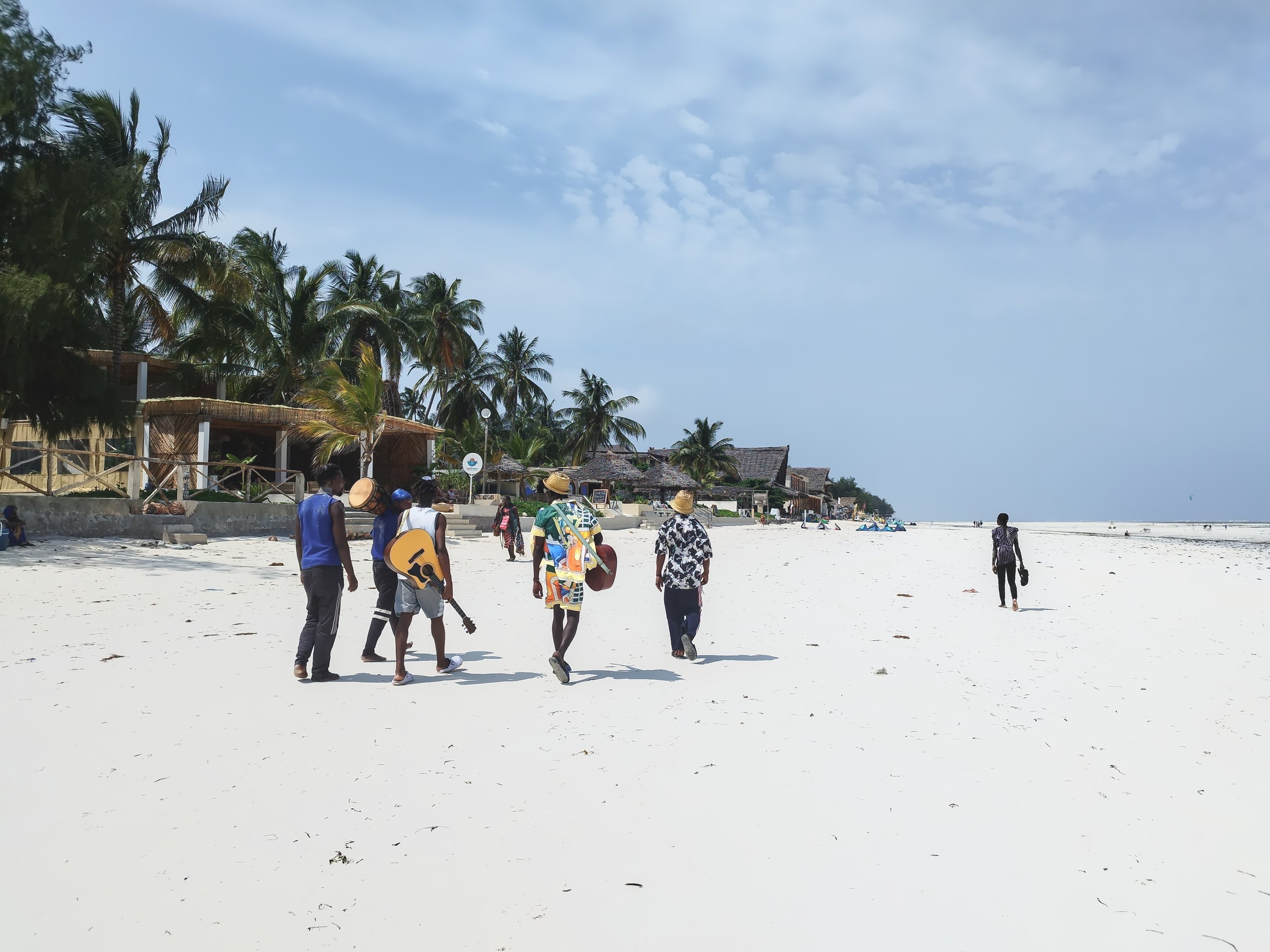 Band on a beach in Zanzibar, Tanzania | Nomad year 2024 summary | FinnsAway Travel Blog
