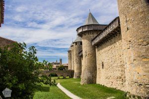 Citadel of Carcassonne is a huge medieval city fortification with double walls and 52 towers. Short history and tips for planning your visit. | FinnsAway Travel Blog