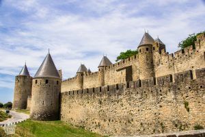 Citadel of Carcassonne is a huge medieval city fortification with double walls and 52 towers. Short history and tips for planning your visit. | FinnsAway Travel Blog